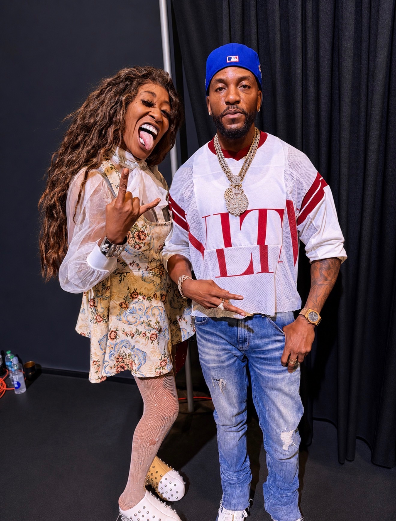 Misty Blanco photographed backstage with an artist