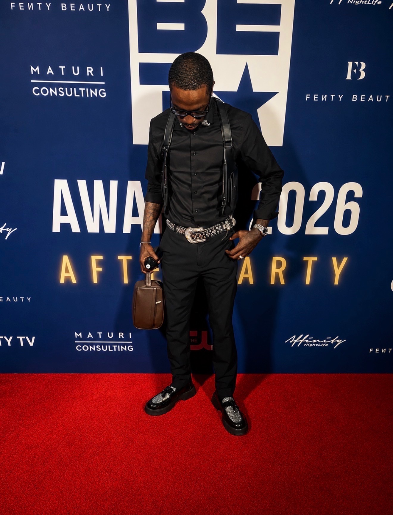 Guest solo portrait on the BET Awards afterparty red carpet during celebrity event coverage