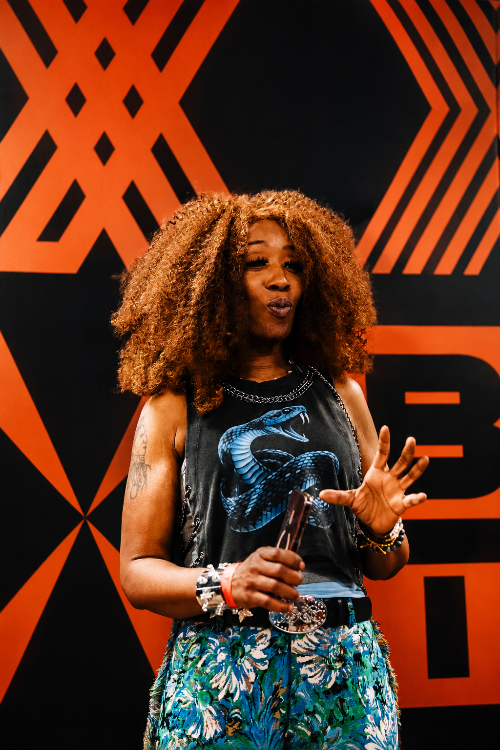 Close-up portrait in front of BETX branding during BET Weekend 2026 media coverage