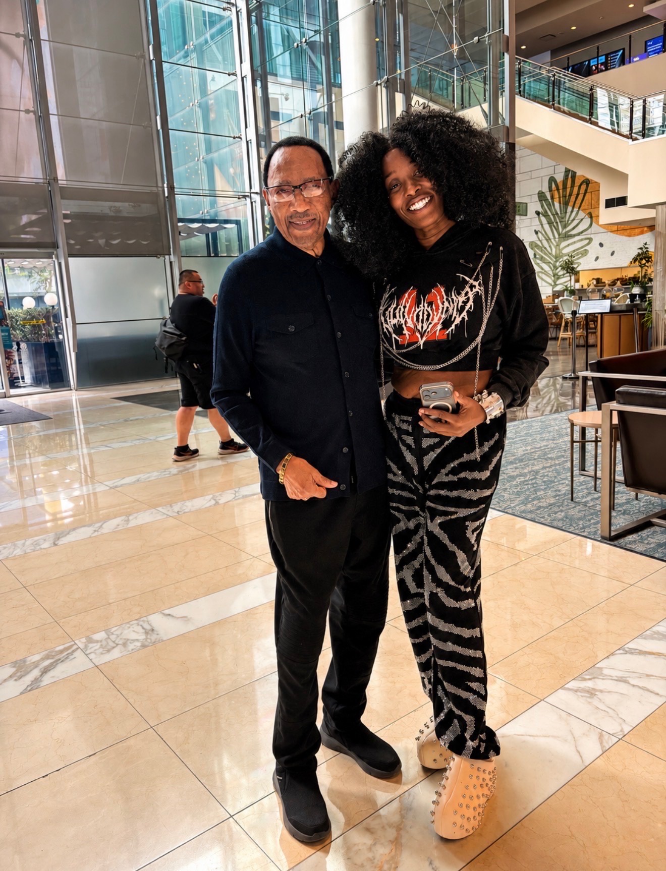 Guest portrait with an entertainment industry elder in a Los Angeles lobby during BET Weekend 2026