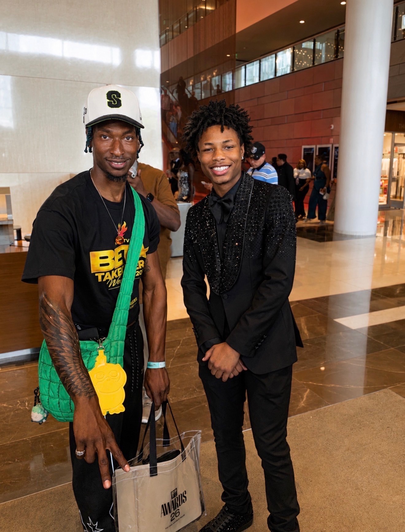 Two guests posing in a venue lobby during BET Awards Weekend 2026 celebrity event coverage