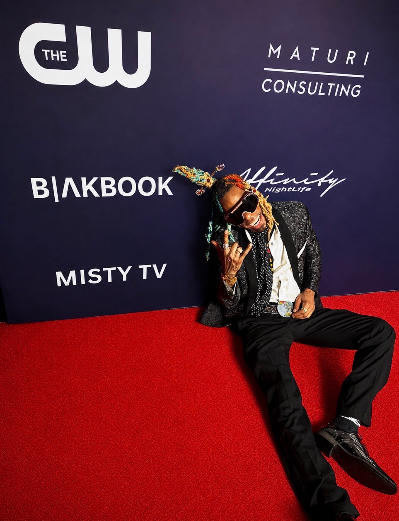 Guest posing at The Misty TV Firm BET Weekend step and repeat for entertainment media coverage