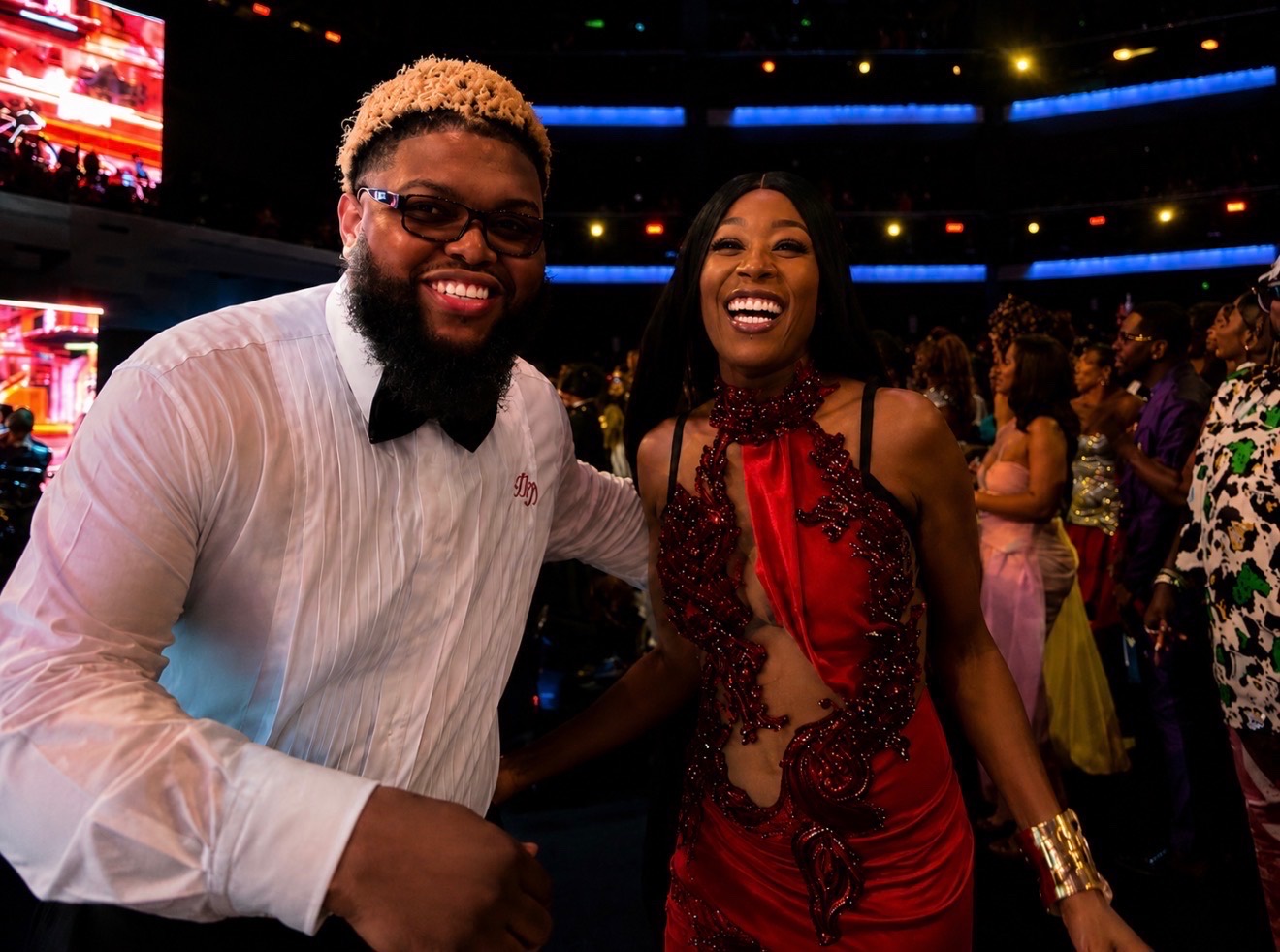 Misty Blanco smiling on the BET Awards floor with a guest during celebrity interview coverage