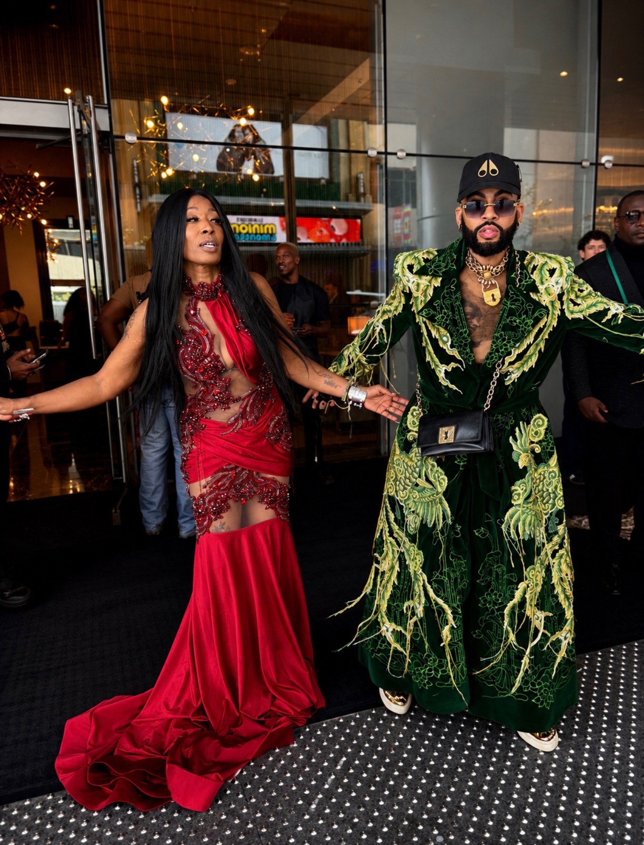 Misty Blanco arriving with a fashion guest in a green robe during BET Awards Weekend 2026