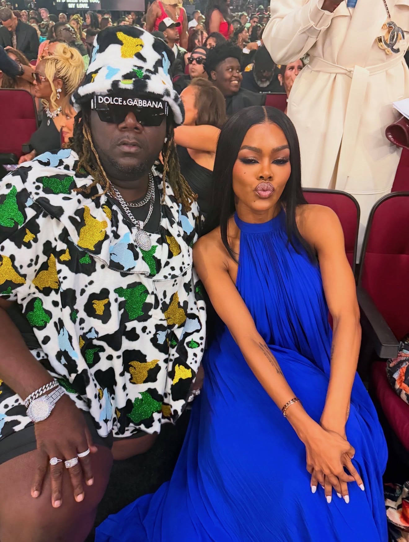 Misty Blanco seated in a blue dress inside the BET Awards 2026 room during celebrity coverage
