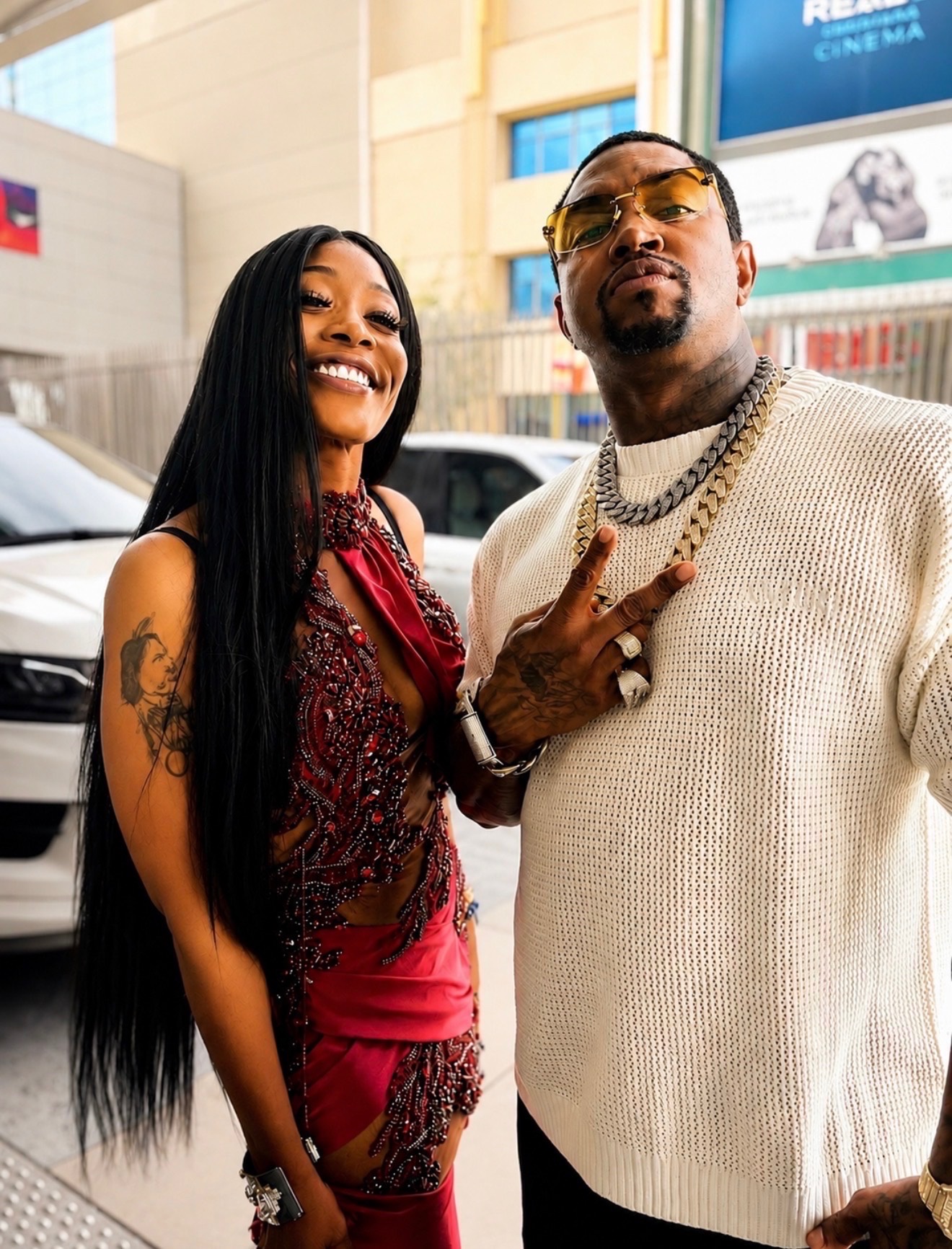 Misty Blanco outdoors with a cream sweater guest during BET Weekend 2026 celebrity event coverage