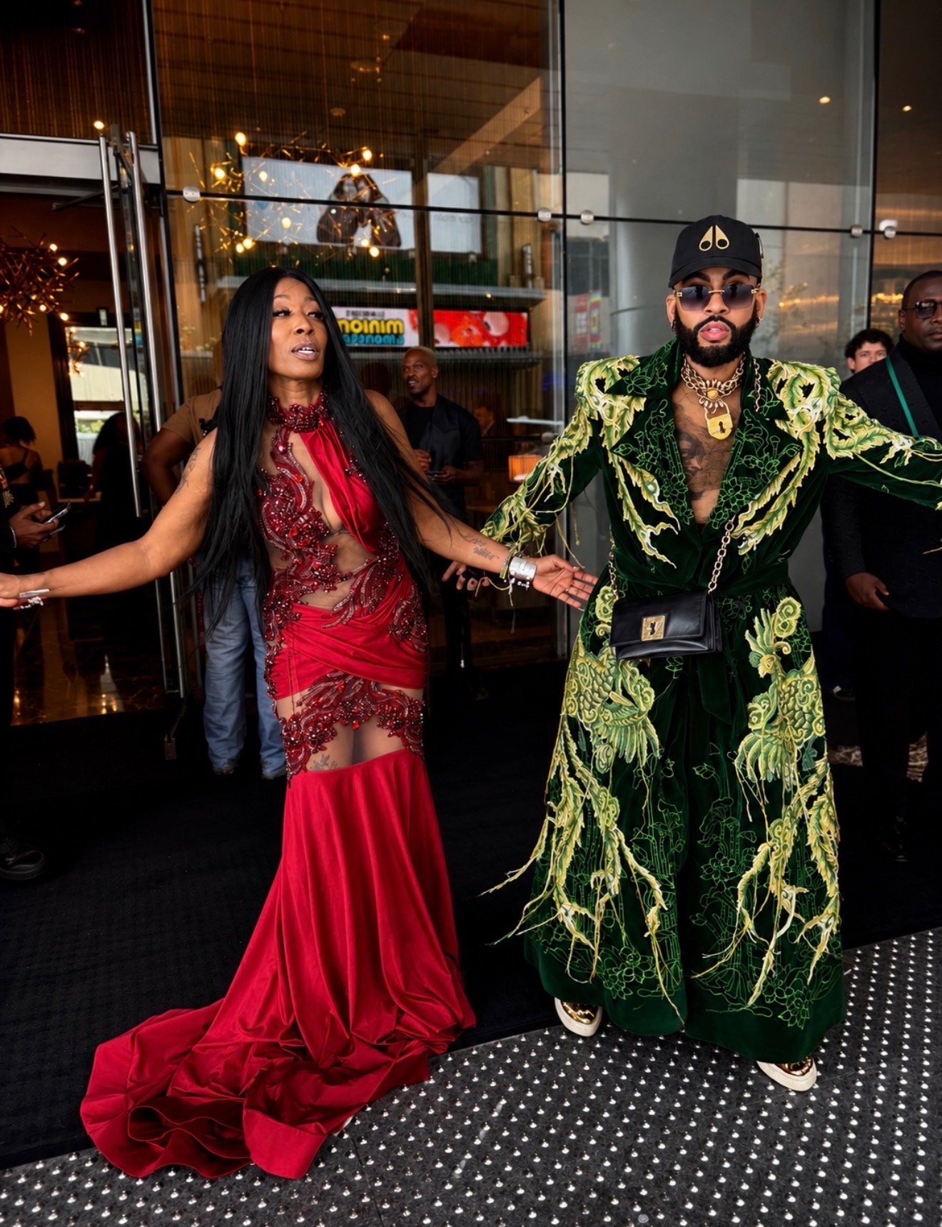 Misty Blanco arriving with a fashion guest in a green robe during BET Awards Weekend 2026