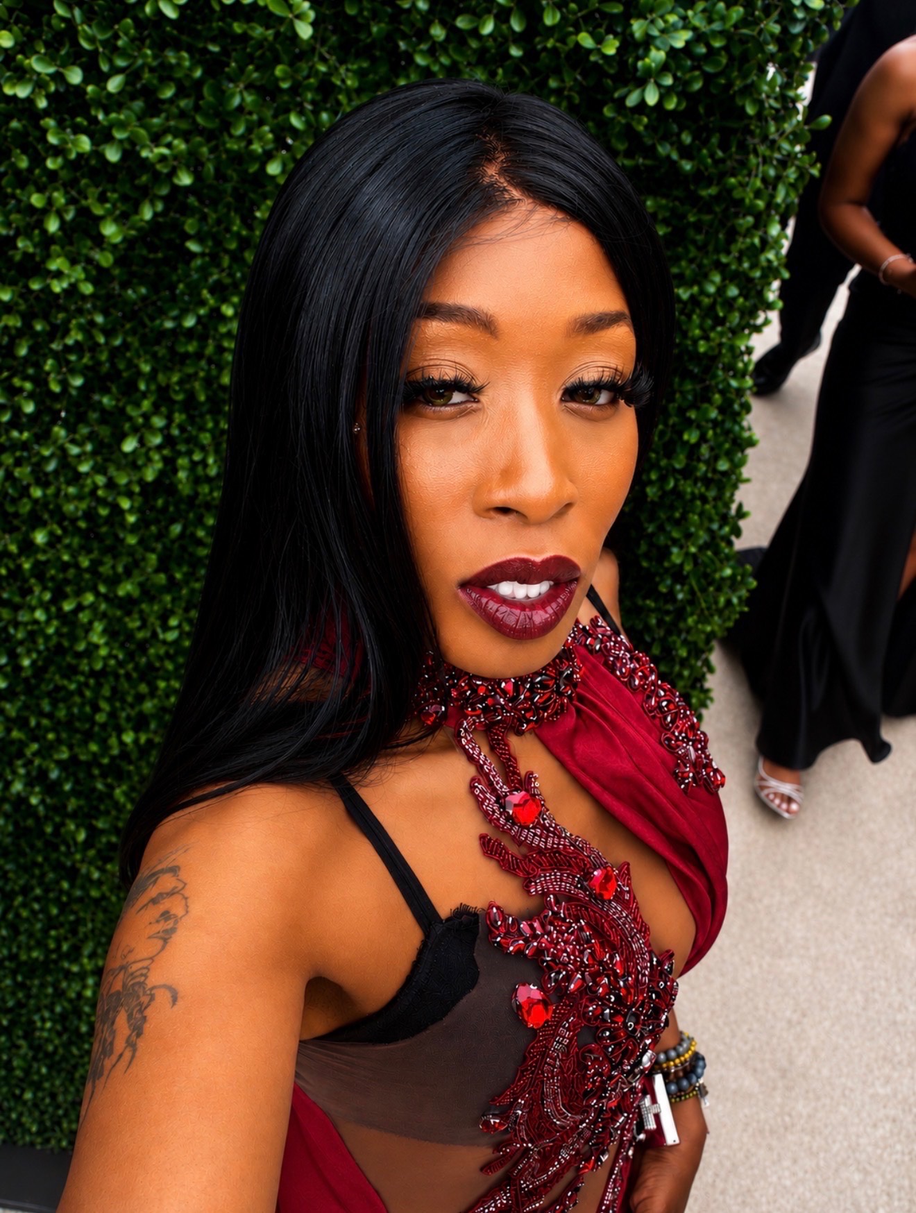 Close-up portrait of Misty Blanco in red dress during BET Awards Weekend 2026 entertainment media coverage