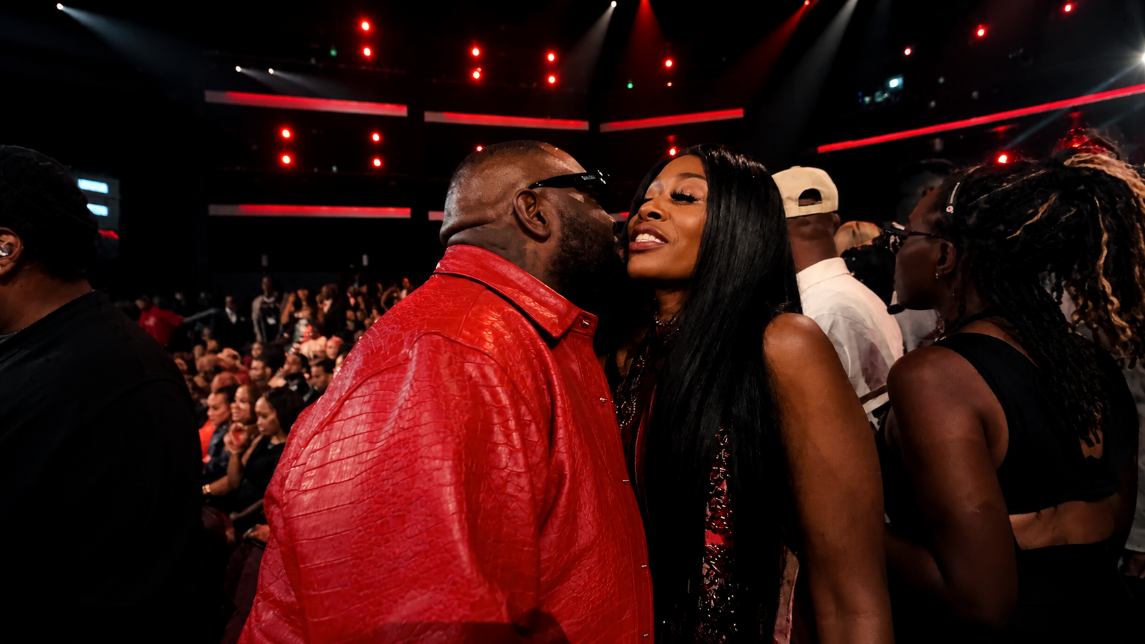 Misty Blanco greeting a guest inside the BET Awards 2026 audience during celebrity media coverage