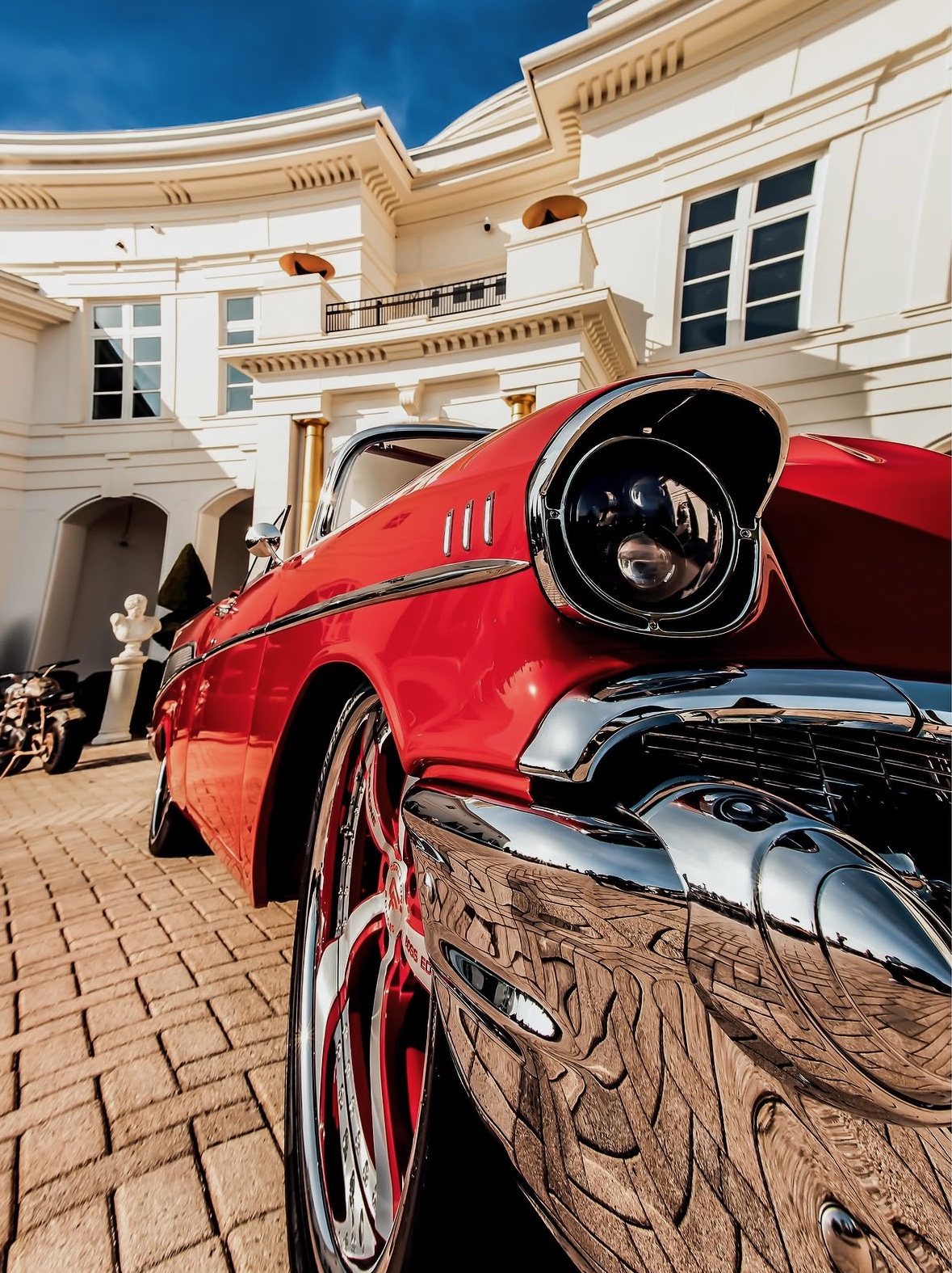 Classic red car photographed at a Rick Ross Car Show lifestyle and automotive event