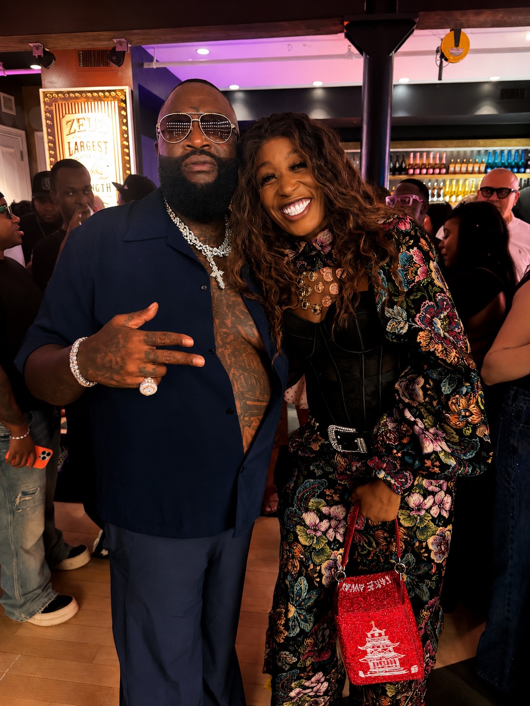 Rick Ross and Misty Blanco during a Rick Ross Car Show media partnership moment